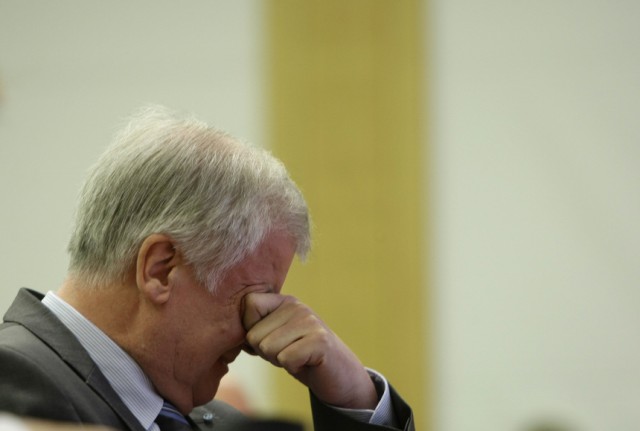 Bavarian state premier Seehofer wipes face before his speech in Munich