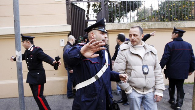 Police work at the scene of an explosion at the Chilean embassy in Rome
