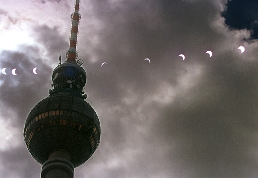 A MULTIPLE EXPOSURE SHOWS A PARTIAL ECLIPSE OF THE SUN IN BERLIN