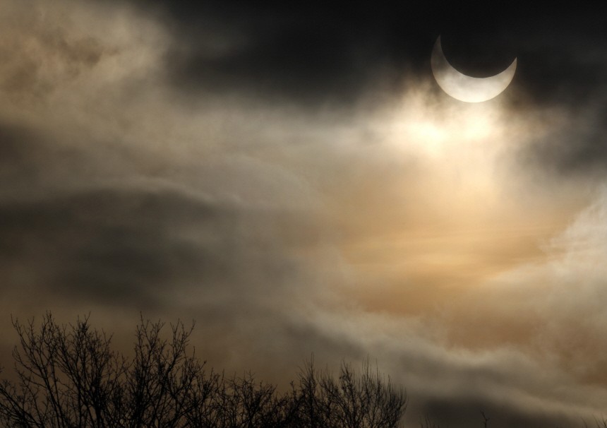 Moon passes between sun and earth during partial solar eclipse in Munich