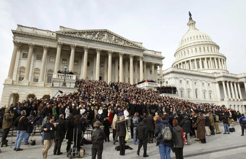 Members of Congress and other Capitol Hill staffers observe a moment of silence on the steps of the U.S. Capitol for Arizona Congresswoman Gabrielle Giffords in Washington