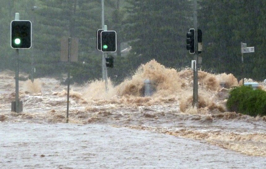 Flash flood sweeps across an intersection in Toowoomba