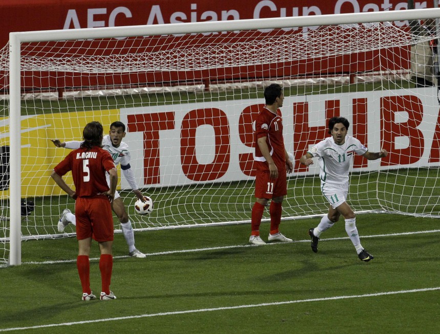 Iraq's Younus celebrates scoring against Iran during their 2011 Asian Cup Group D soccer match in Doha