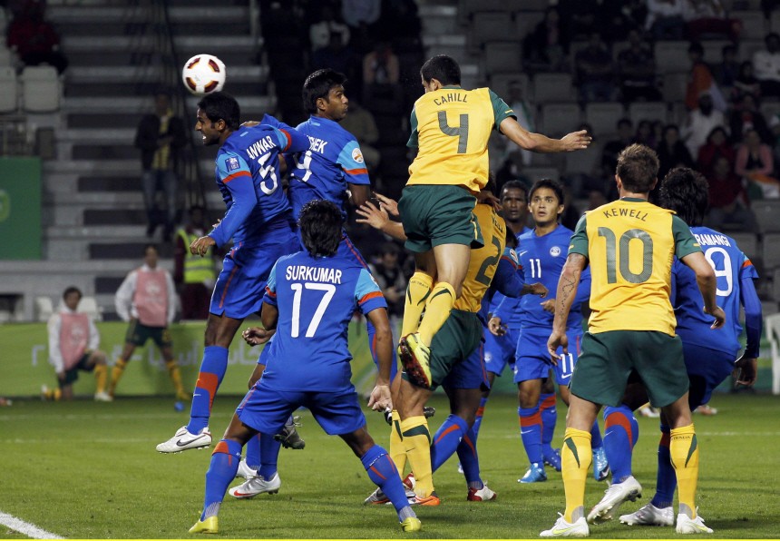 Australia's Tim Cahill scores his team's fourth goal against India during their 2011 Asian Cup Group C soccer match at Al Sadd stadium in Doha