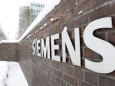 People walk in Siemens factory in Munich