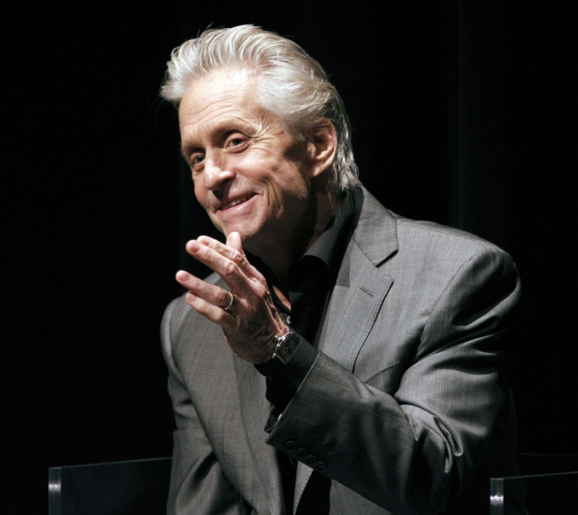 Actor Michael Douglas waves to the audience during a question and answer segment before he receives the Icon Award at the 22nd Annual Palm Springs International Film Festival Gala