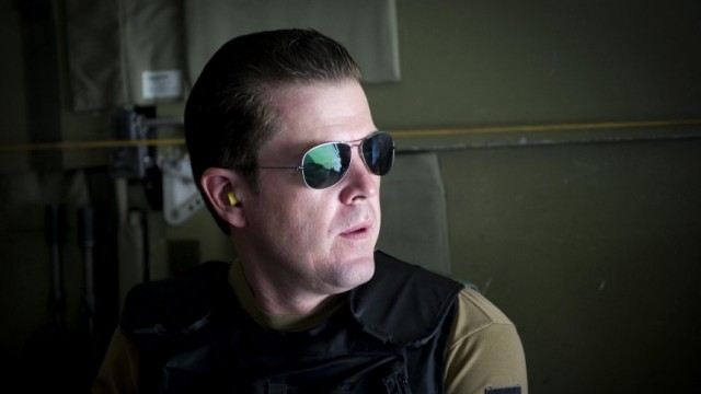 German Defence Minister Karl-Theodor zu Guttenberg sits in a helicopter on his way to Kunduz