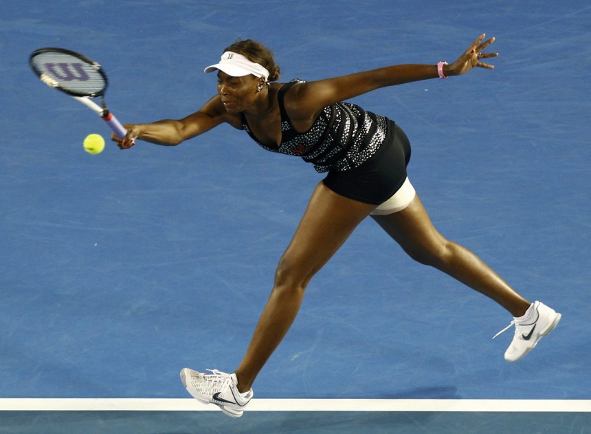 Williams of the U.S. grimaces as she hits a shot during her match against Petkovic of Germany at the Australian Open tennis tournament in Melbourne