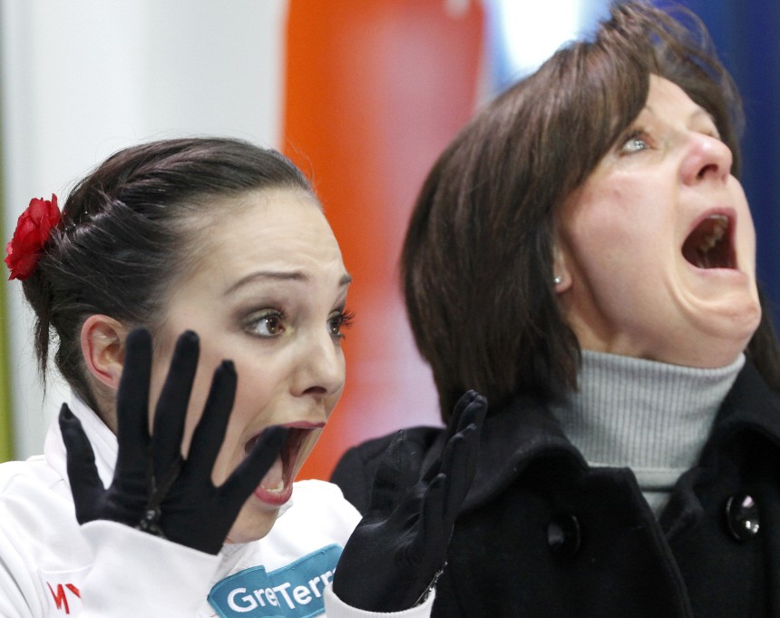 Meier of Switzerland reacts with her coach Fehr after winning first place in women's free skating competition at European Figure Skating Championships in Bern