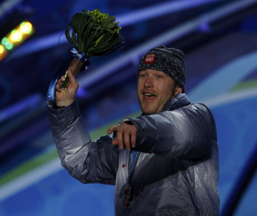 Bronze medallist Miller of the U.S. throws his bouquet during the medal ceremony for the men's Alpine skiing downhill competition in Whistler