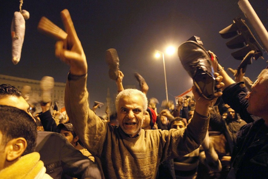 Protesters react in Tahrir Square to Egyptian President Hosni Mubarak's televised speech in Cairo