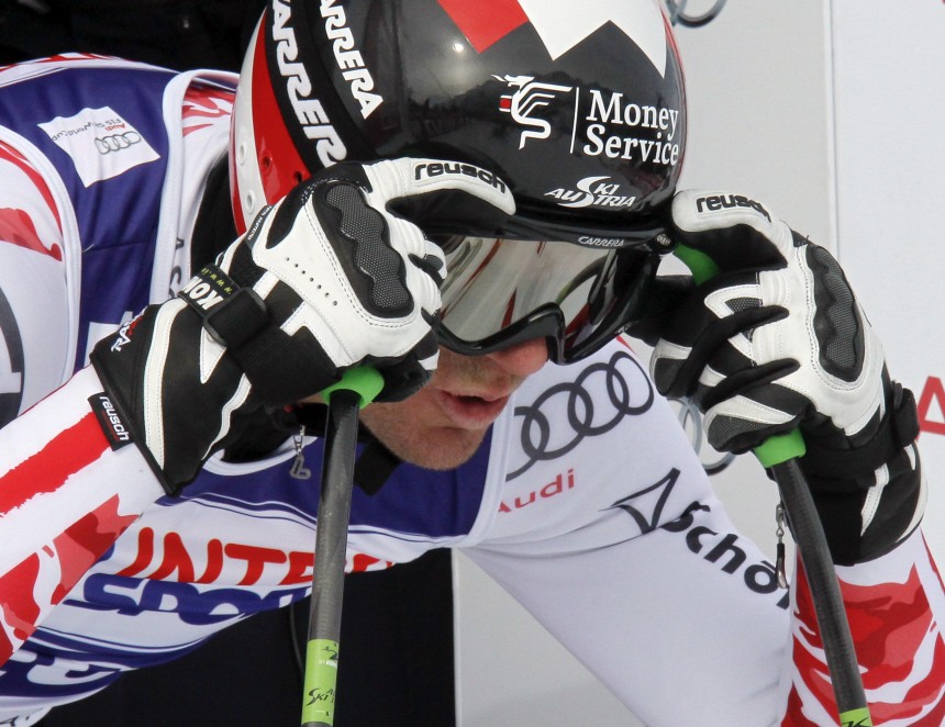 Walchhofer of Austria adjusts his glasses at starting point during second training session of men's Alpine Skiing World Cup downhill event in Les Houches