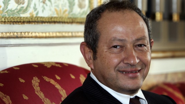 Egyptian businessman Sawiris smiles before news conference in Rome