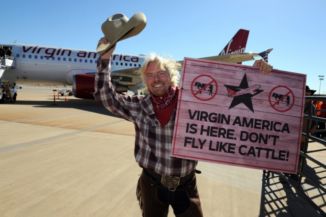 Virgin Group Founder Branson welcomes guests from the airline's inaugural flight from Los Angeles into Dallas-Fort Worth International Airport in Dallas in handout photograph