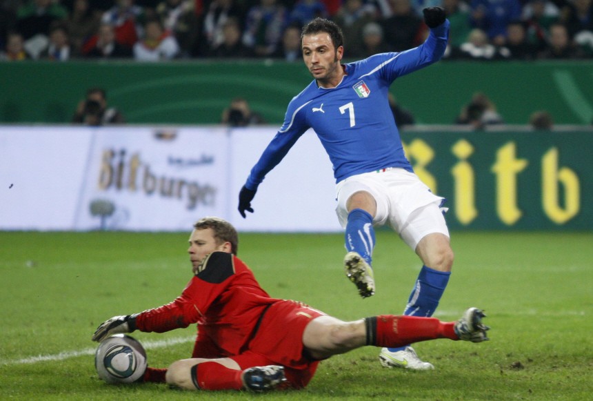Germany's goalkeeper Neuer is challenged by Italy's Pazzini during their international friendly soccer match in Dortmund