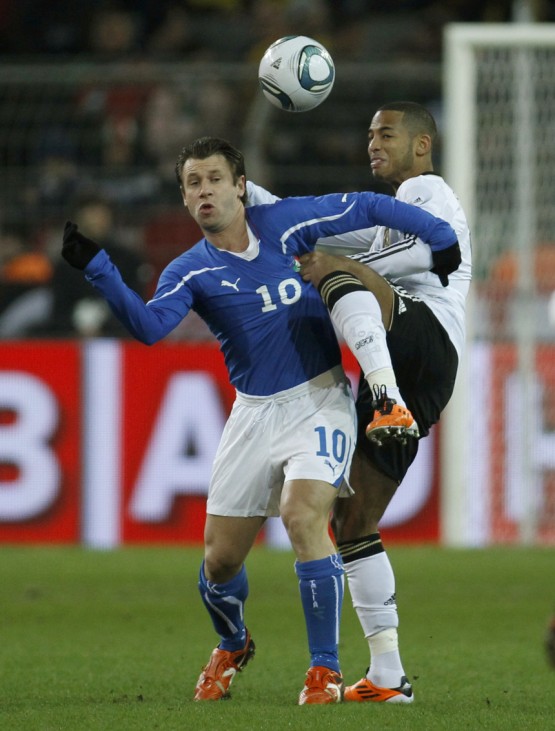 Germany's Aogo challenges Italy's Cassano during their international friendly soccer match in Dortmund