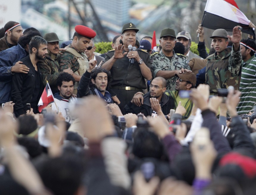 An Egyptian army commander, Hassan al-Roweny, addresses protesters in the opposition stronghold of Tahrir Square