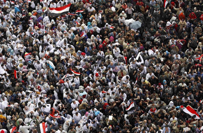 Local doctors and nurses chant anti-government slogans during mass demonstrations inside Tahrir Square in Cairo