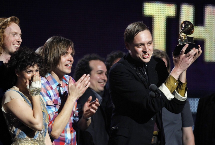 Edwin Butler of Canadian band Arcade Fire holds up the Grammy for Album of the Year for 'The Suburbs' at the 53rd annual Grammy Awards in Los Angeles
