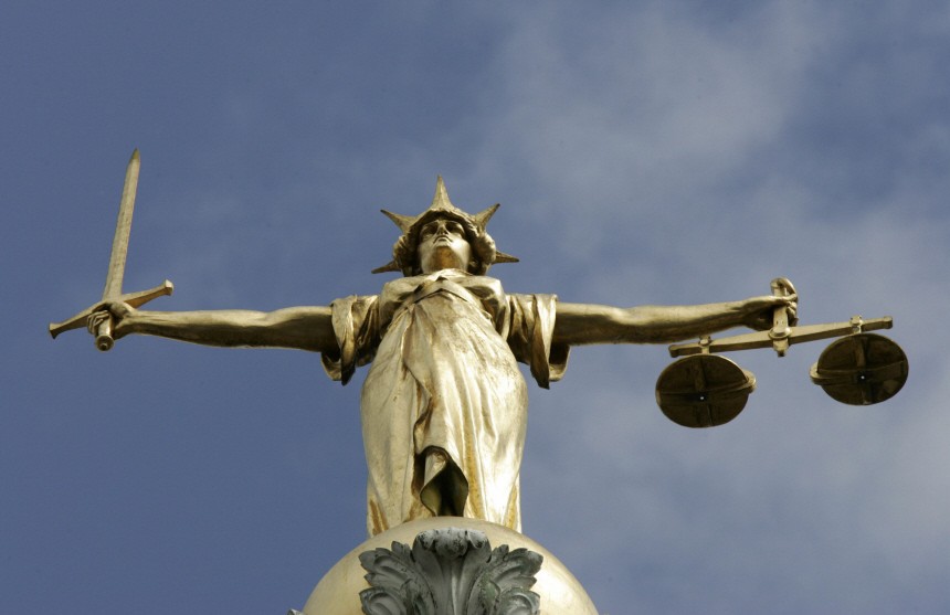 The Statue of Justice is seen on top of the Old Bailey in London