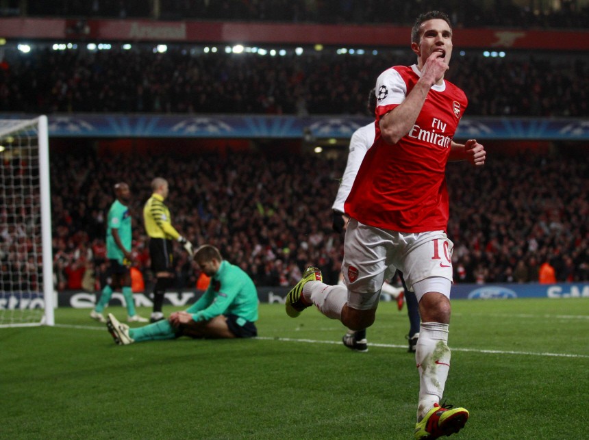 Robin van Persie of Arsenal celebrates scoring against Barcelona during their Champions League soccer match in north London