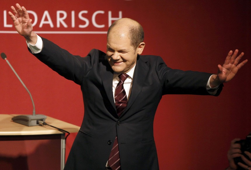 SPD top candidate Scholz acknowlegdes supporters after hearing first exit polls for the state election in Hamburg at party headquarters in Hamburg