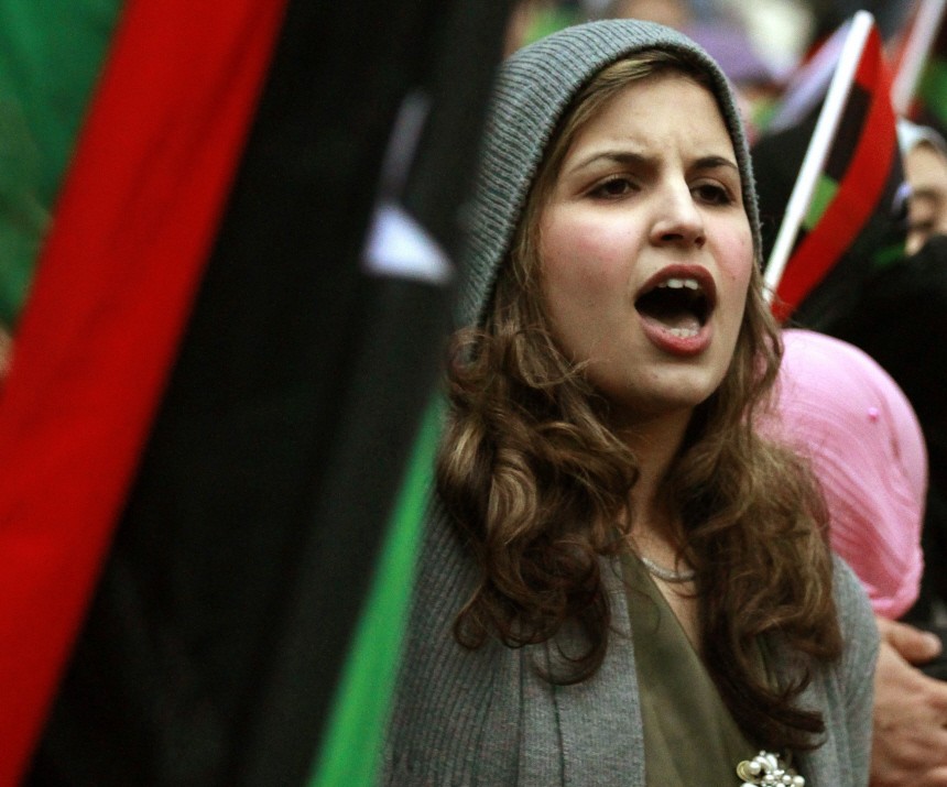 A demonstrator protests against Libya's leader Muammar Gaddafi outside the Libyan Embassy in London