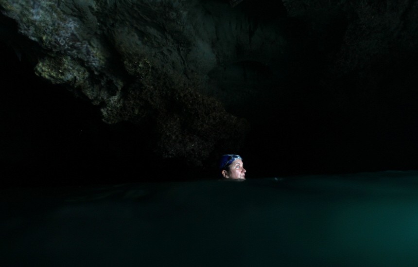A swim through darkness to a serene cave beach at Thailand's Emer