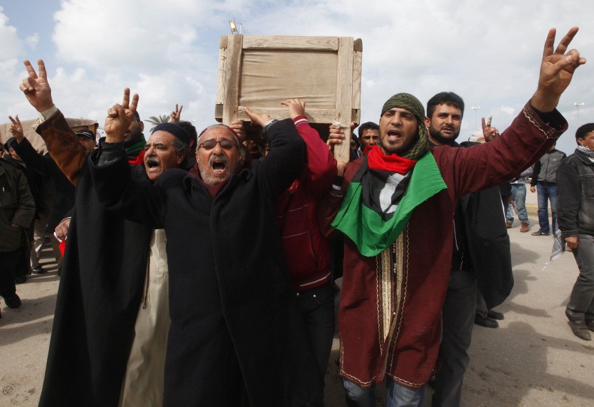 Mourners carry a coffin containing the body of a Libyan who was killed in the recent clashes in Benghazi
