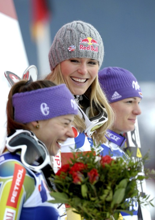 Maze from Slovenia, Vonn from the U.S. and Riesch from Germany pose on the podium after the women's World Cup downhill ski race in Are