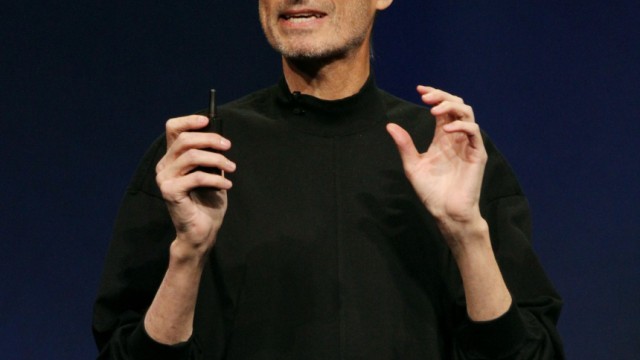 Steve Jobs introduces the iPad 2 on stage during an Apple event in San Francisco