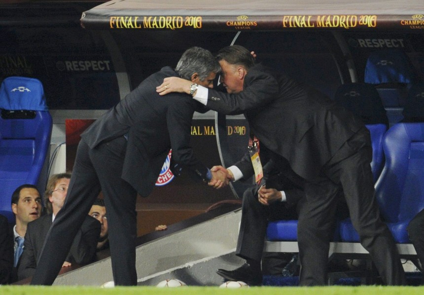 Inter Milan's manager Mourinho shakes hands with Bayern Munich's manager van Gaal during their Champions League final soccer match in Madrid