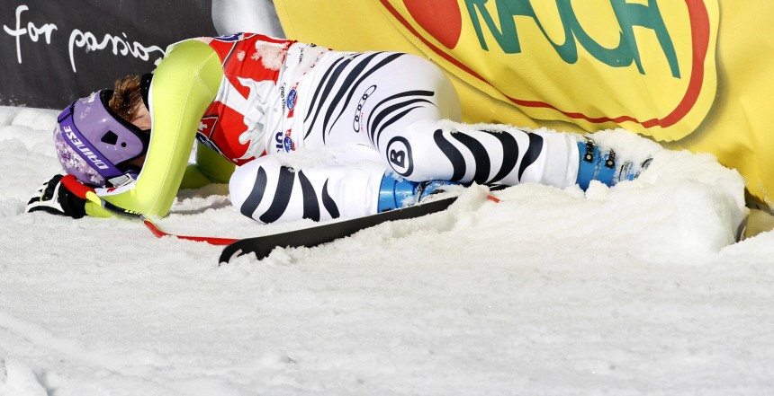 Riesch of Germany reacts after falling while crossing the finish line of the the downhill women's Alpine Ski World Cup race in Italy's northern mountain resort of Tarvisio