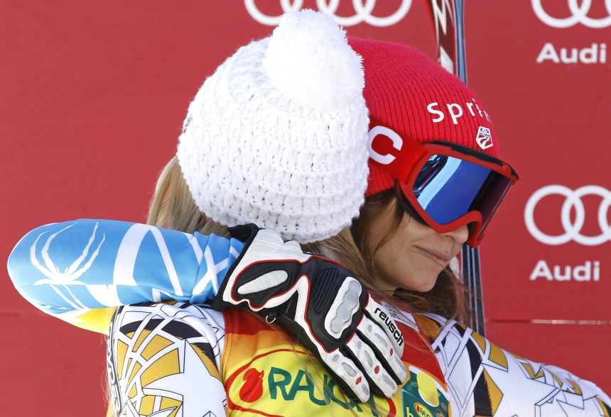 Vonn of the U.S. embraces her compatriot Mancuso on the podium in Italy's northern mountain resort of Tarvisio