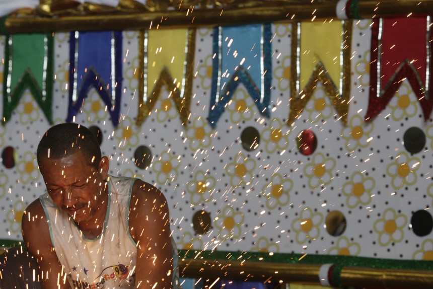A worker prepares a carnival float at Grande-Rio Samba School in Rio de Janeiro