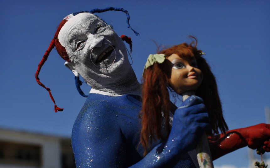 A reveller participates in the last day of the annual national carnival parade in Santo Domingo