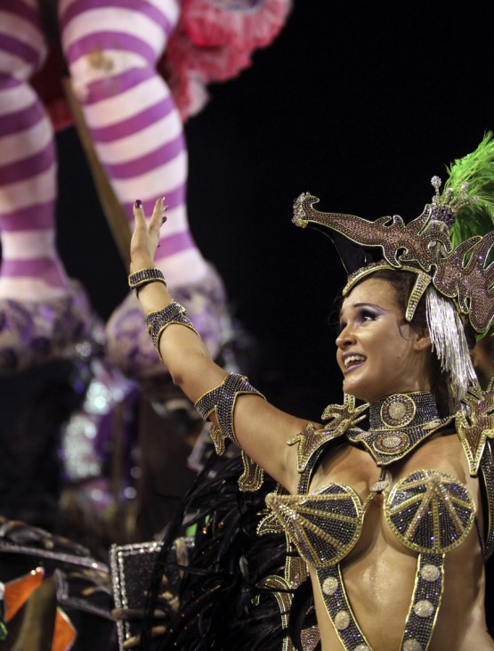 A reveller of the Porto da Pedra samba school participates in the Carnival parade in Rio