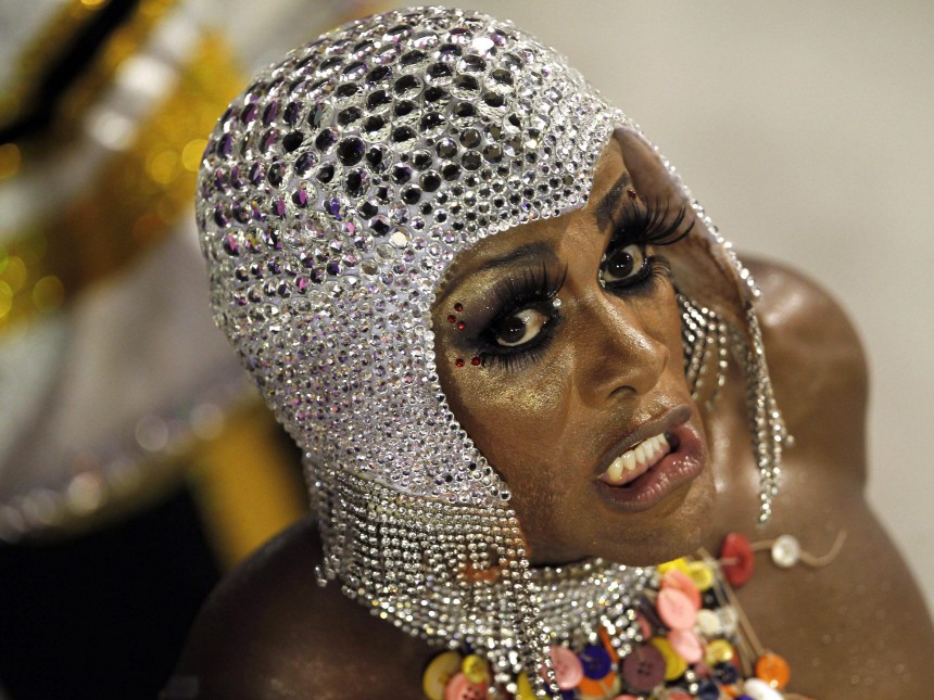 A reveler of the Salgueiro samba school participates in the Carnival parade in Rio