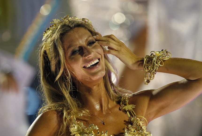 Brazilian model Gisele Bundchen dances atop a float of the Vila Isabel samba school during the annual Carnival parade in Rio de Janeiro's Sambadrome