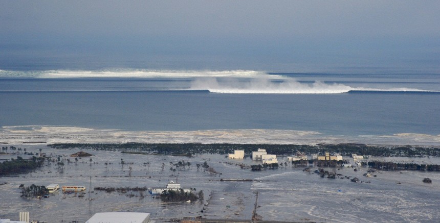 The oncoming tsunami strikes the coast in Natori City, Miyagi Prefecture
