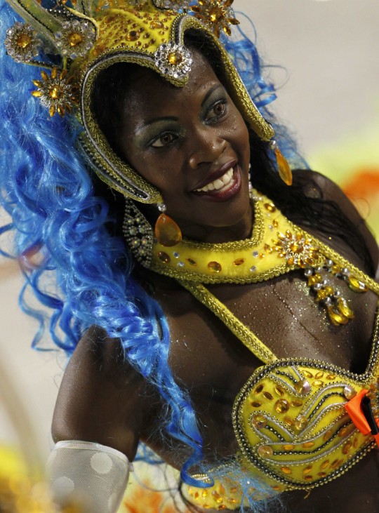 A reveller of the Imperatriz Leopoldinense samba school participates in the annual Carnival parade in Rio de Janeiro's Sambadrome