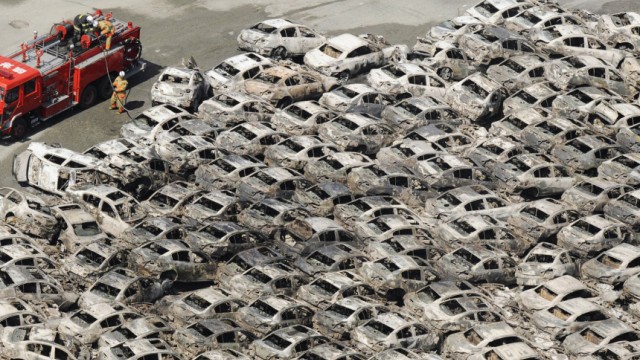 Burned-out cars are pictured at Hitachi Harbour in Ibaraki Prefecture in northeastern Japan