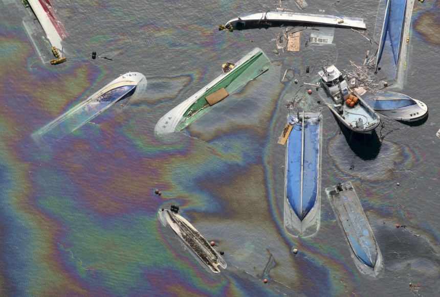 Oil leaks from ships swept by the tsunami after the earthquake