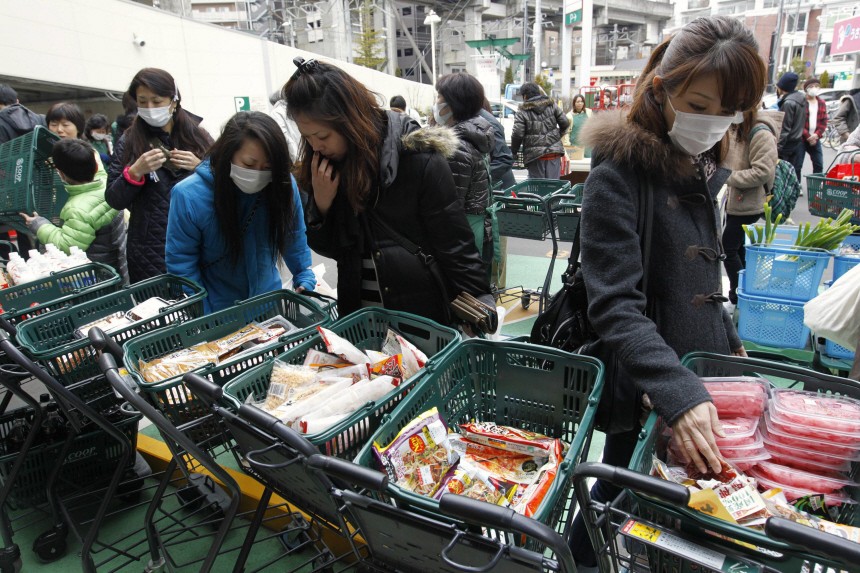 Residents buy food at a temporarily opened supermarket in Sendai, northeastern Japan