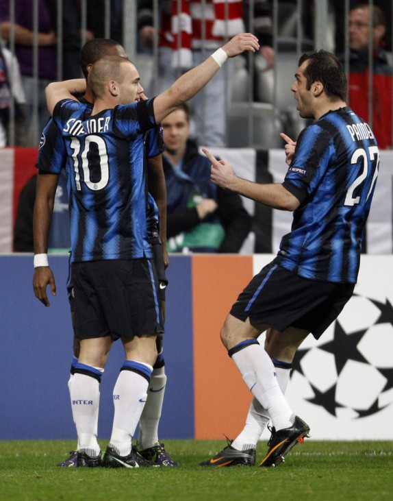 Inter Milan's Samuel Eto'o, Wesley Sneijder and Goran Pandev celebrate a goal during their second leg round of sixteen Champions League soccer match against Bayern Munich in Munich