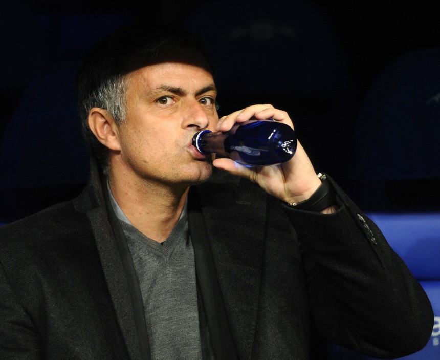 Real Madrid's coach Mourinho drinks before their Champions League soccer match against Olympique Lyon in Madrid