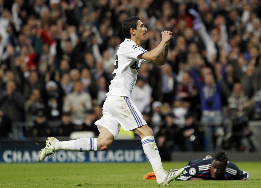 Real Madrid's Di Maria celebrates after scoring against Olympique Lyon during their Champions League soccer match in Madrid