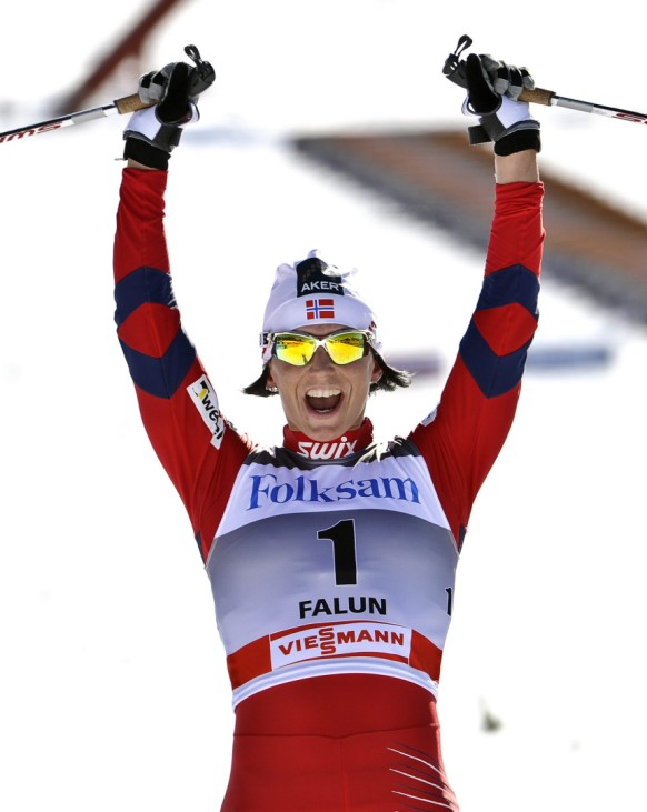 Norway's Marit Bjorgen reacts after winning the Ladies' Pursuit 5 km Classic + 5 km Free  World Cup ski race in Falun