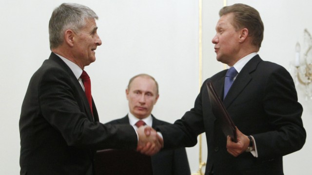 BASF AG Board Chairman Hambrecht shakes hands with Gazprom Chief Executive Miller during their meeting at Novo-Ogaryovo residence outside Moscow