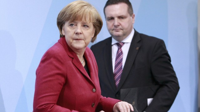 German Chancellor Merkel and Baden-Wuerttemberg's state premier Mappus arrive for a news conference after a meeting in the Chancellery in Berlin